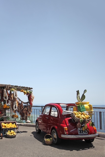 Photo of a Fiat car with the ocean behind